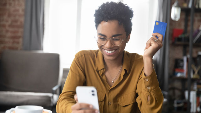 woman using phone to make a digital transaction