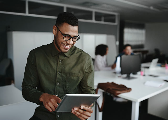 Man on laptop in office